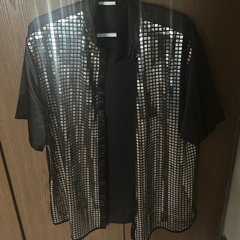 I am selling a disco ball button shirt that I used for a concert